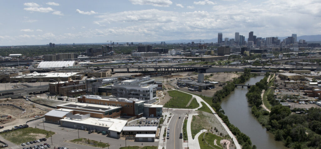 Aerial view of the CSU Spur campus with downtown Denver in the background.